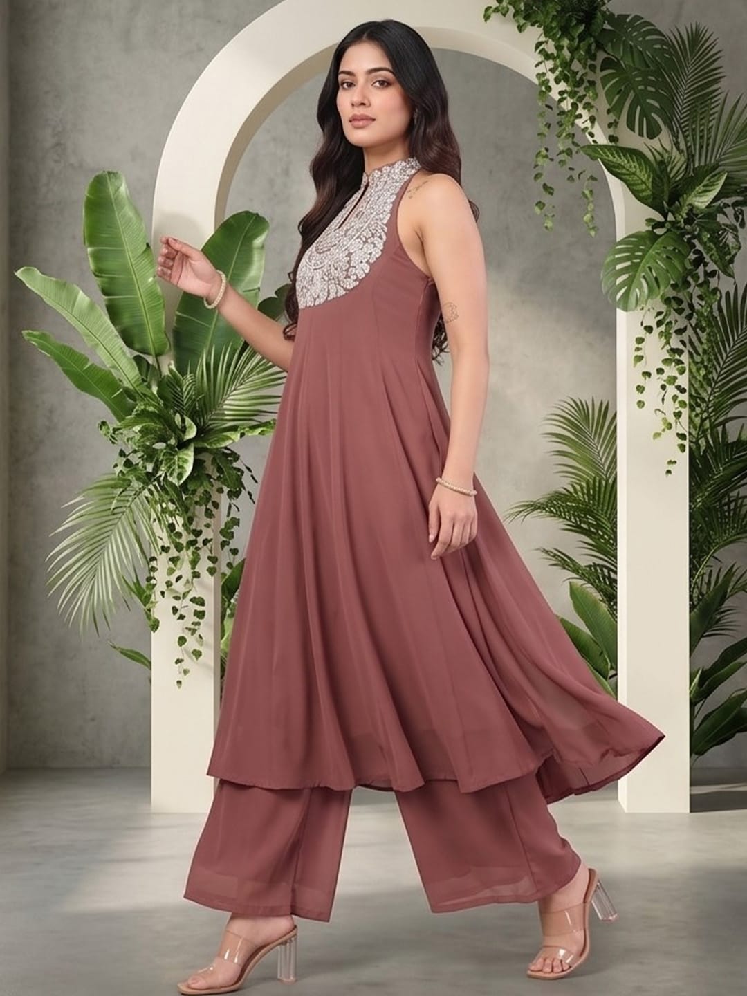 The Kurti Collection Women Nude Yoke Embroidered Sleeveless Flared Kurta With Trousers.