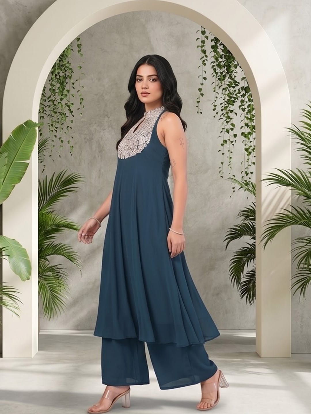 The Kurti Collection Women Blue Yoke Embroidered Sleeveless Flared Kurta With Trousers.