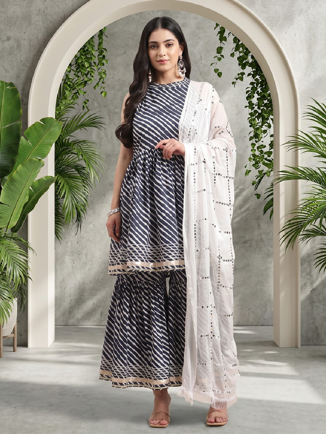 The Kurti Collection Blue And White Leheriya Halter Neckline Gota Work Kurta With Sharara And Sequins Emebllished Dupatta.
