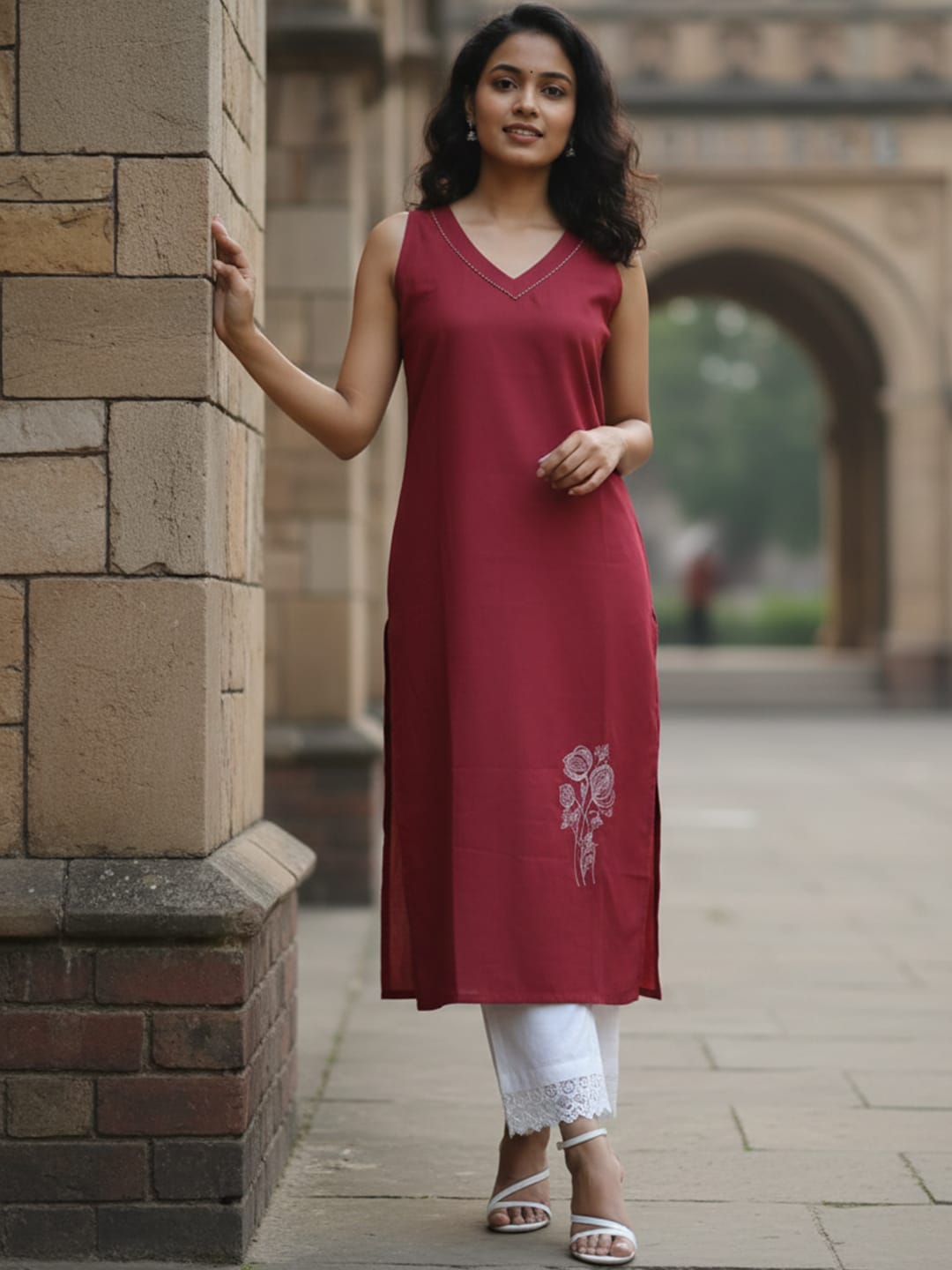 Sleeveless Solid Kurta with V-Neck and Subtle Floral Embroidery paired with trouser