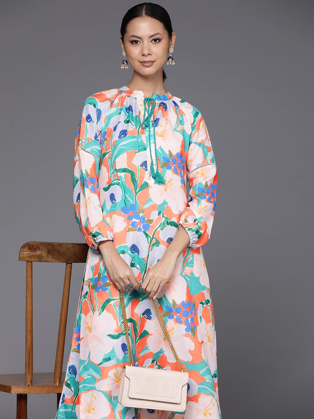 KSUT Women Orange Floral Printed Straight Kurta Paired With Printed Bottom