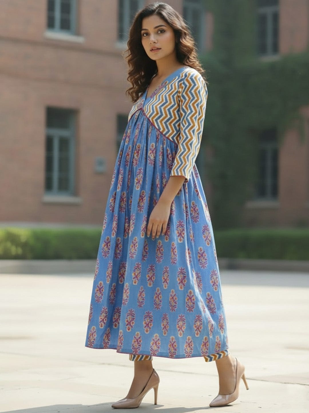 Classic ikat print Aliya-cut kurta in blue and white, teamed with regular-fit ankle-length trousers.