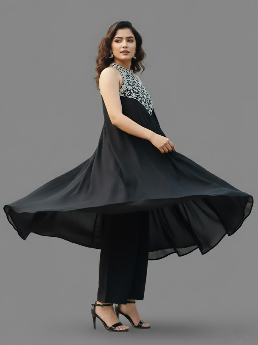 Black halter-neck A-line kurta featuring delicate white floral embroidery with matching solid trousers.