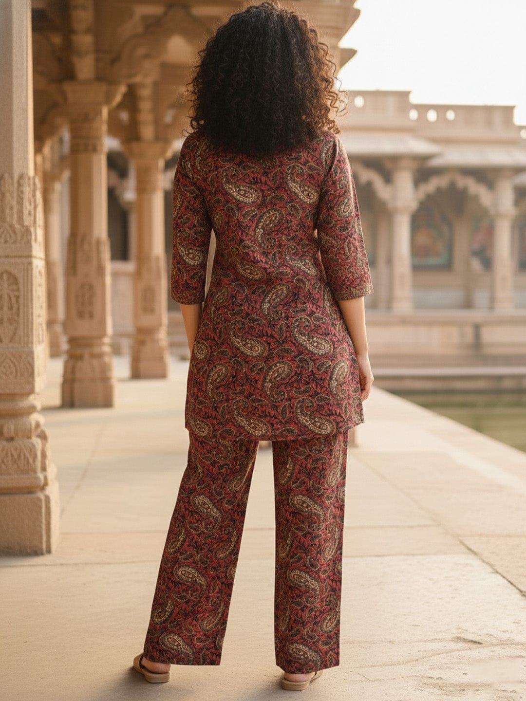 The Kurti Collection women's Maroon Ethnic Kurta Set Straight-fit kurta with slit neckline, paired with straight trousers.