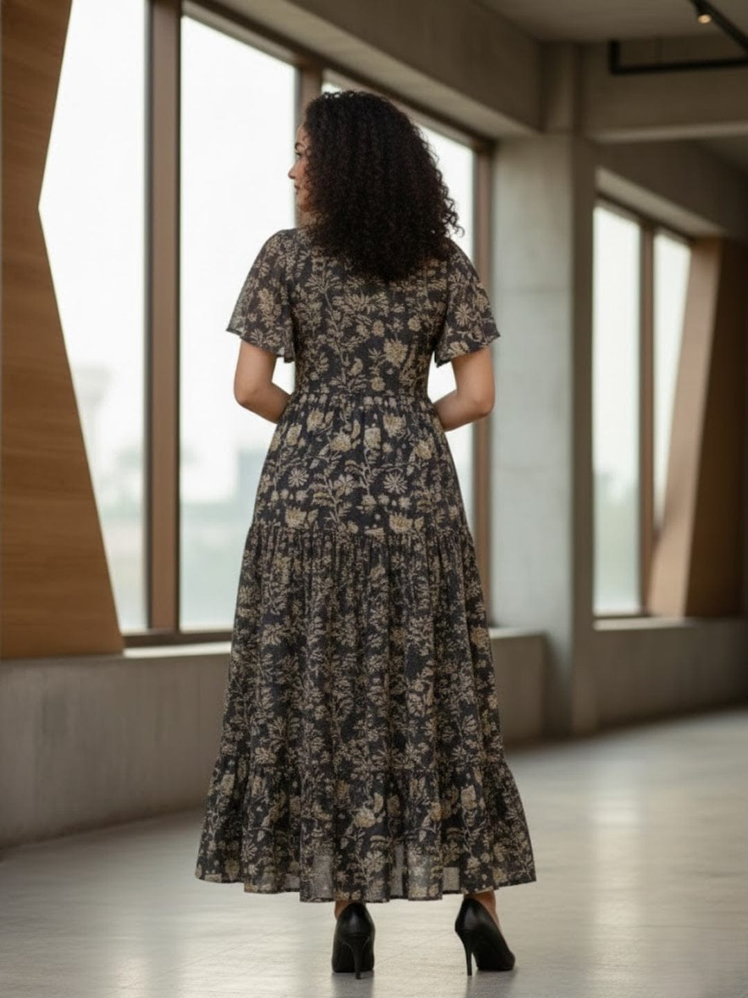 The Kurti Collection Women's Ethnic Floral Printed Brown Flared Dress featuring a V-Neck and Flared Sleeves.