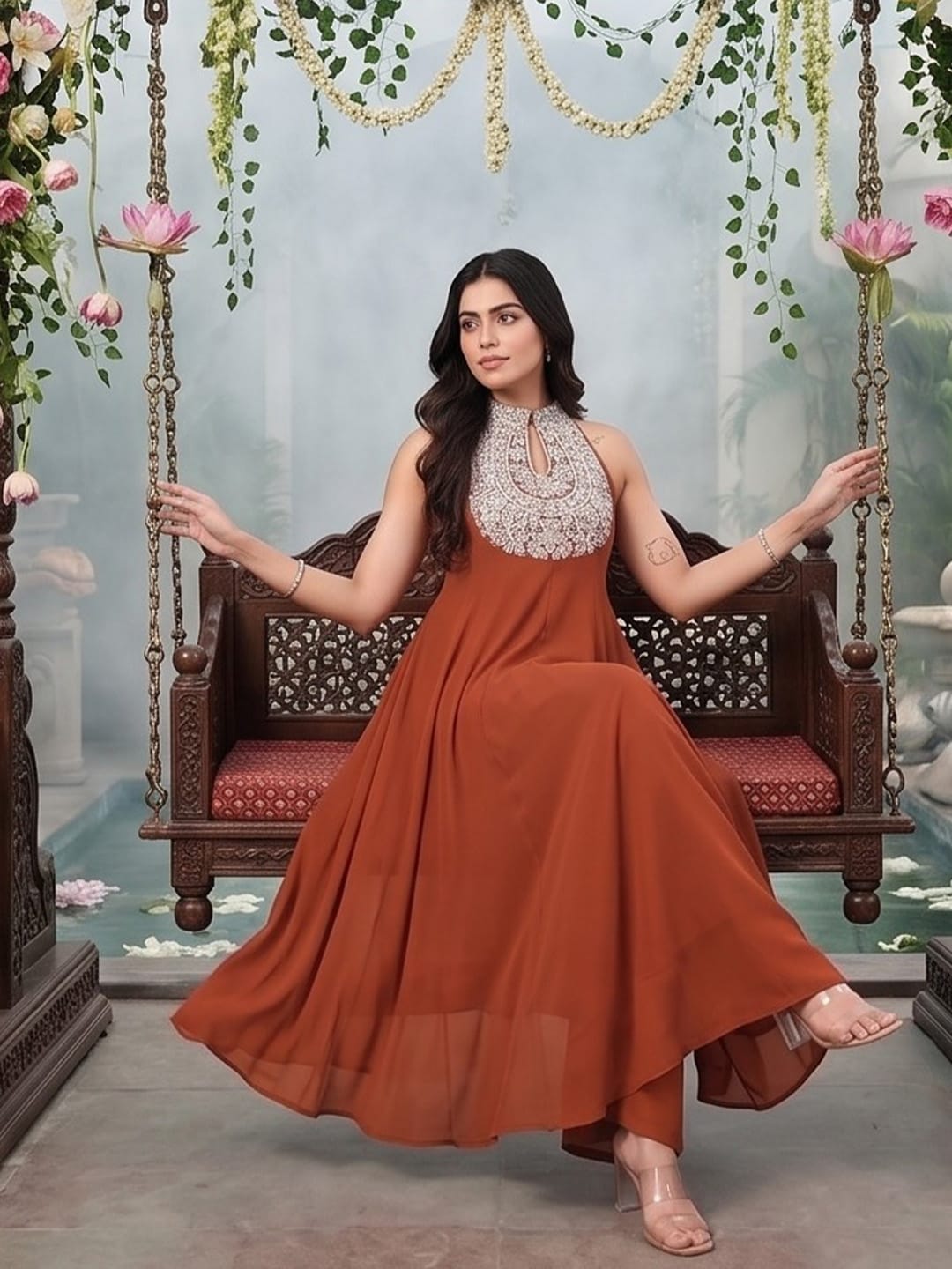 The Kurti Collection Women Rust Yoke Embroidered Sleeveless Flared Kurta With Trousers.
