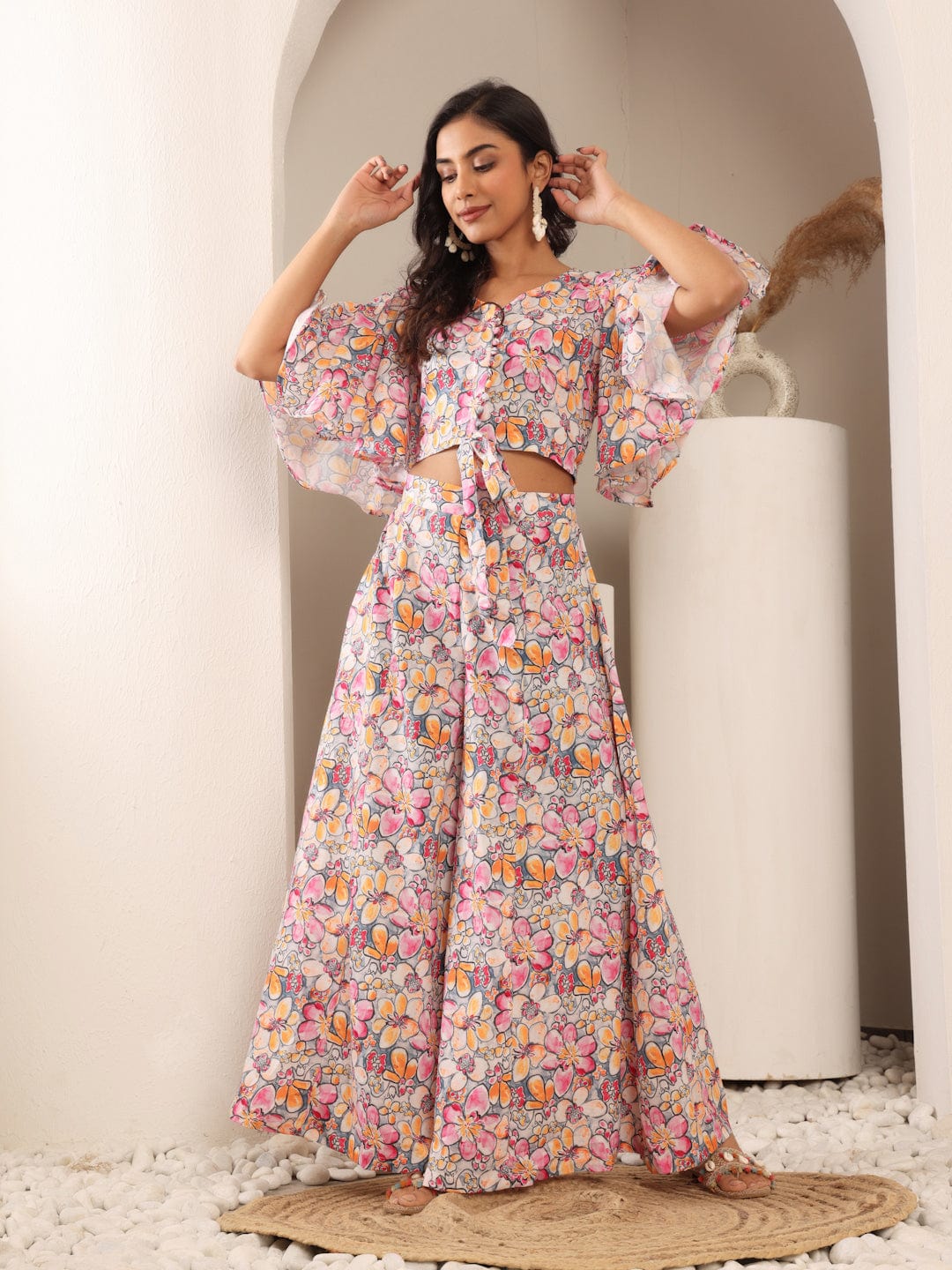 The Kurti Collection Women Grey Floral Printed Crop Top With Flared Sleeves, Front Open Tie Up Details Paired With Flared Bottom.
