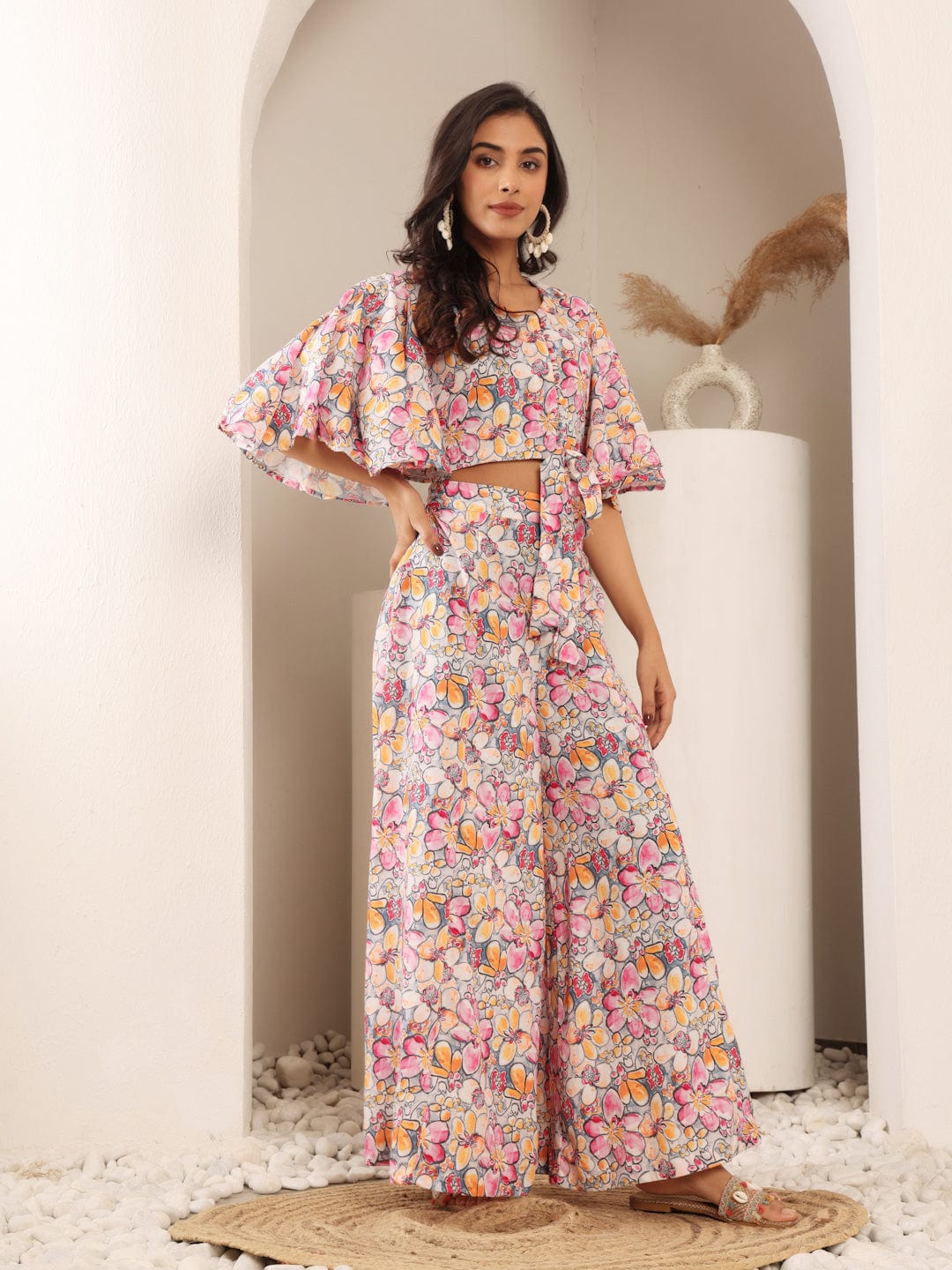 The Kurti Collection Women Grey Floral Printed Crop Top With Flared Sleeves, Front Open Tie Up Details Paired With Flared Bottom.
