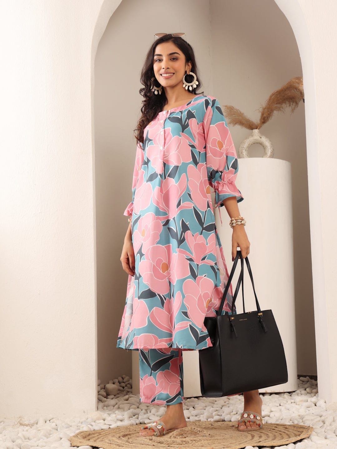 The Kurti Collection Women Blue And Pink Floral Printed Kurta Set With Side Slit And Trendy Puffy Sleeve With Tie Detail.