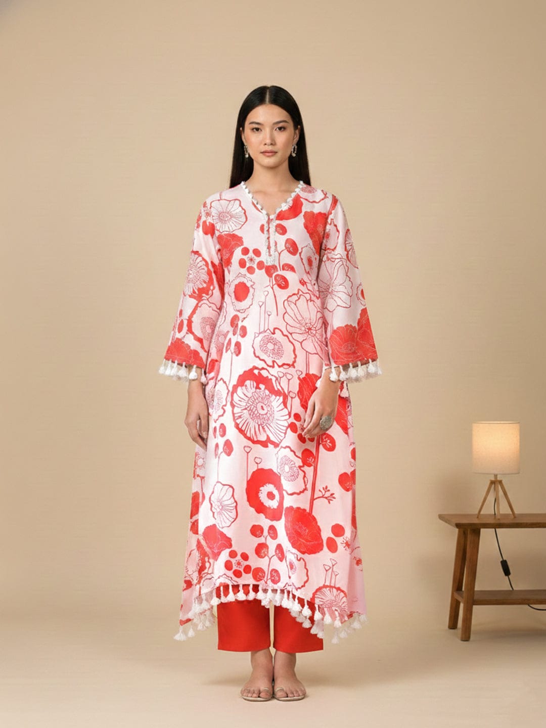 KSUT Women Peach Floral Printed V-Neck Straight Kurta With Tessels Hem Paired With Tonal Solid Bottom