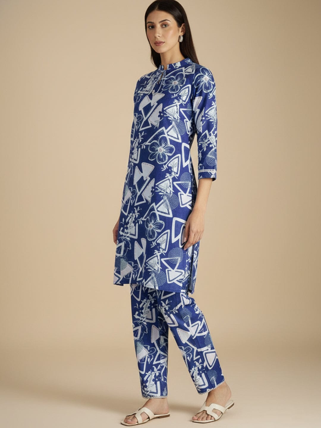 Blue and white printed straight kurta with a mandarin collar, paired with solid straight-fit trousers perfect for everyday elegance and comfort.