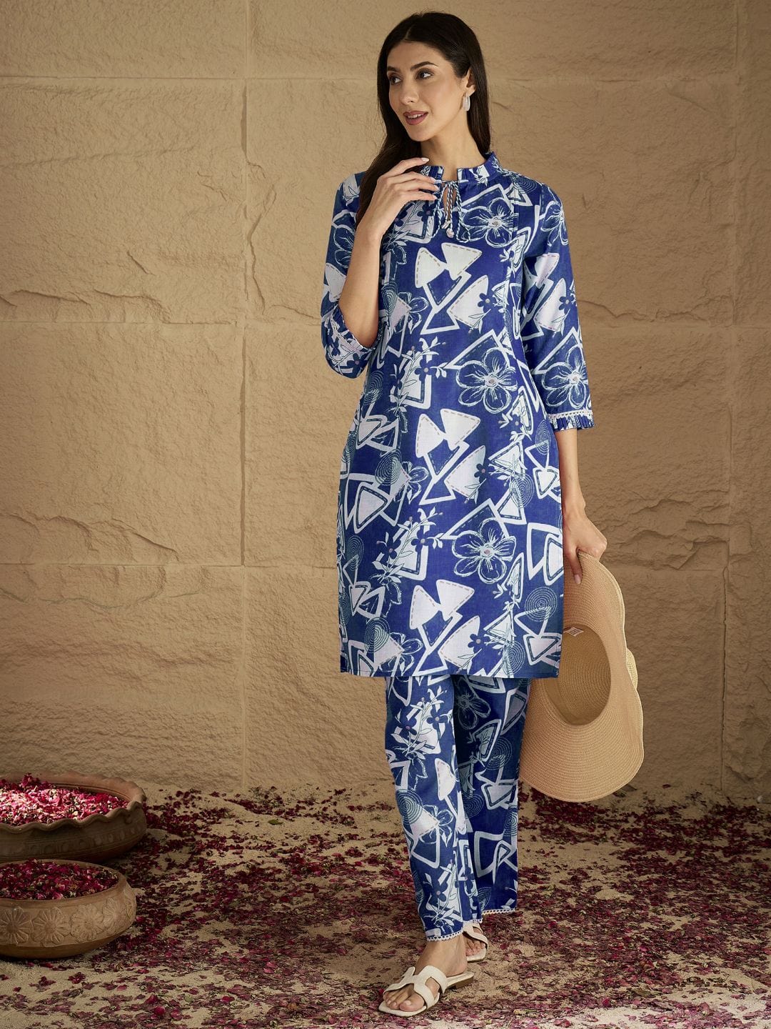 Blue and white printed straight kurta with a mandarin collar, paired with solid straight-fit trousers perfect for everyday elegance and comfort.