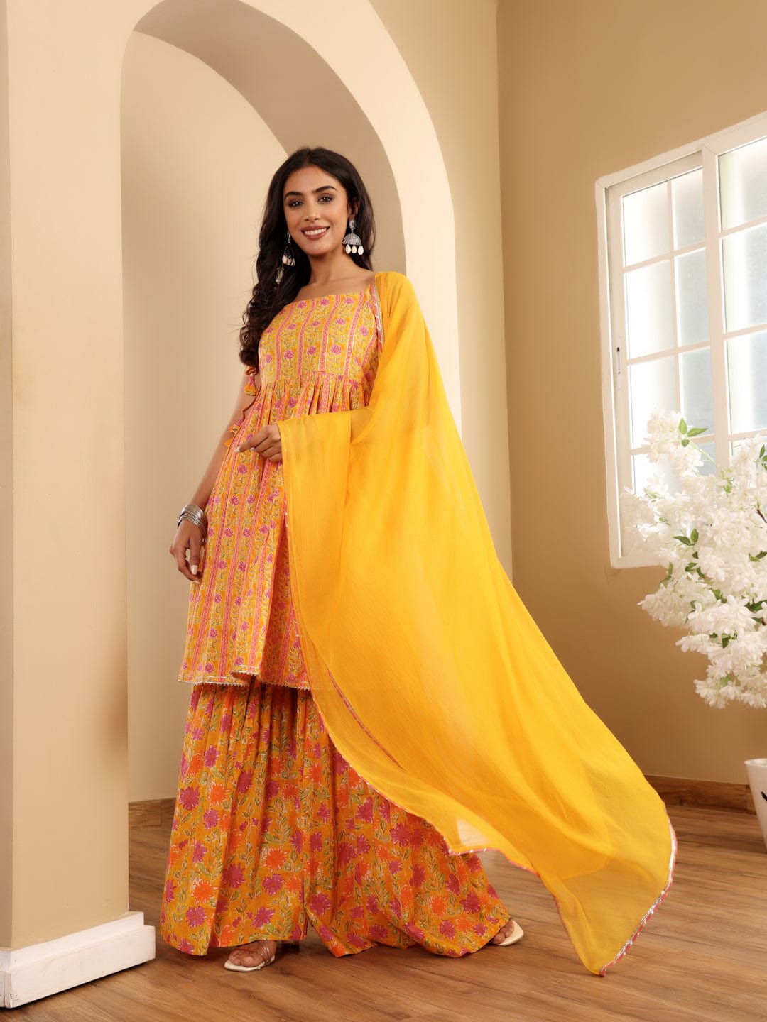 The Kurti Collection Women Floral Printed Strappy Flared Kurta With Sharara & Dupatta