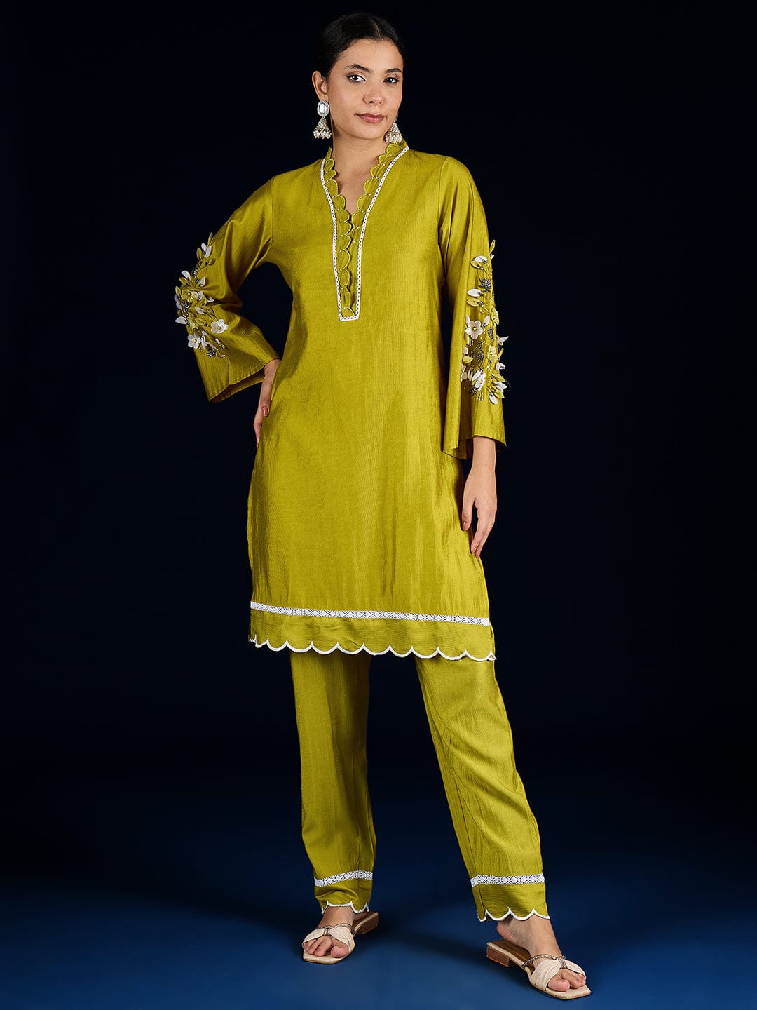 The Kurti Collection Kurta Set With 3D Work On The Sleeves Paired With Solid Trousers And Dupatta.