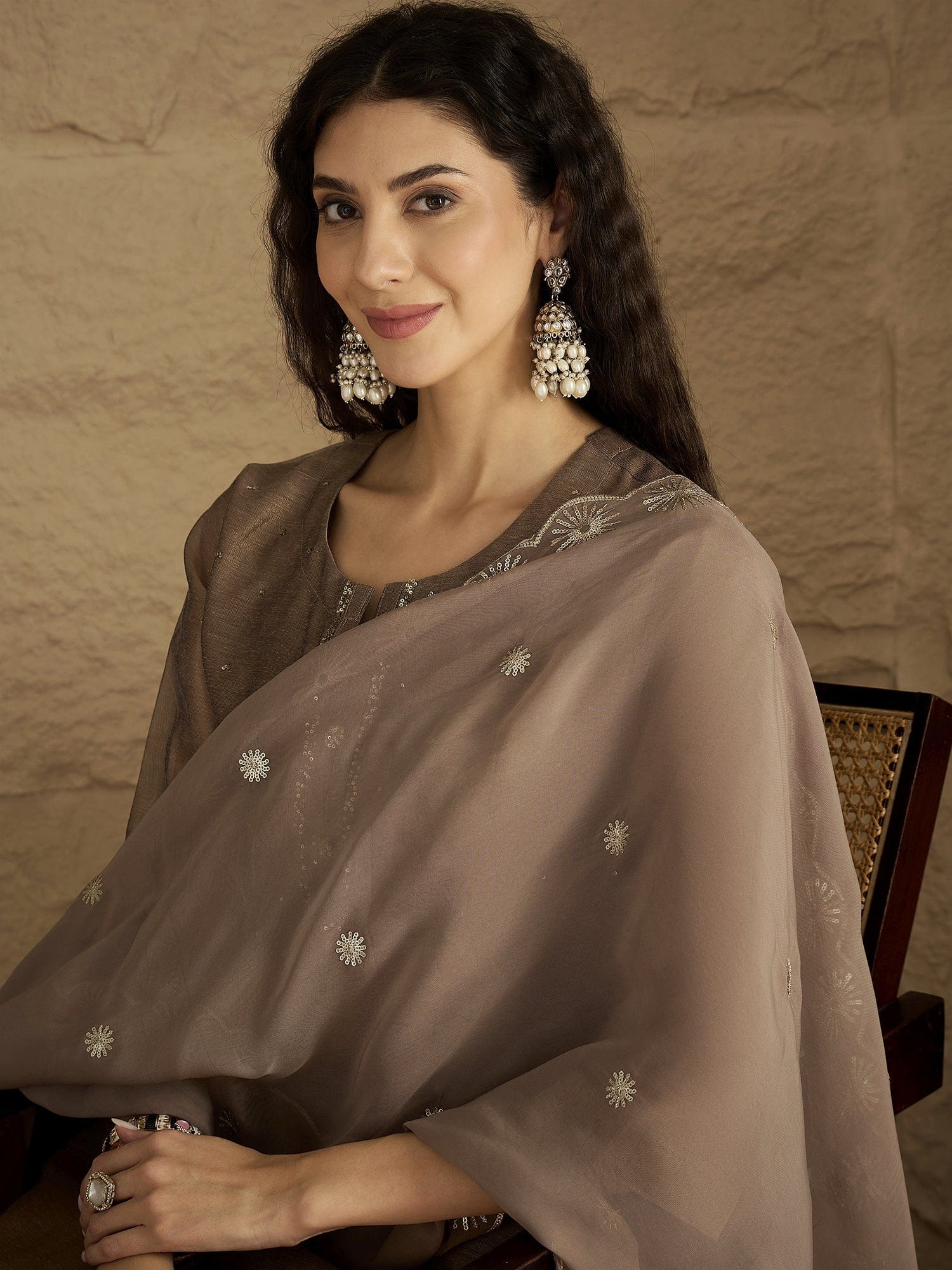 The Kurti Collection Women Elegant Three-Piece Brown Shimmer Kurta Set With Sequin Detailing, Solid Ankle-Length Trousers, And An Embroidered Dupatta Perfect For Festive Occasions.