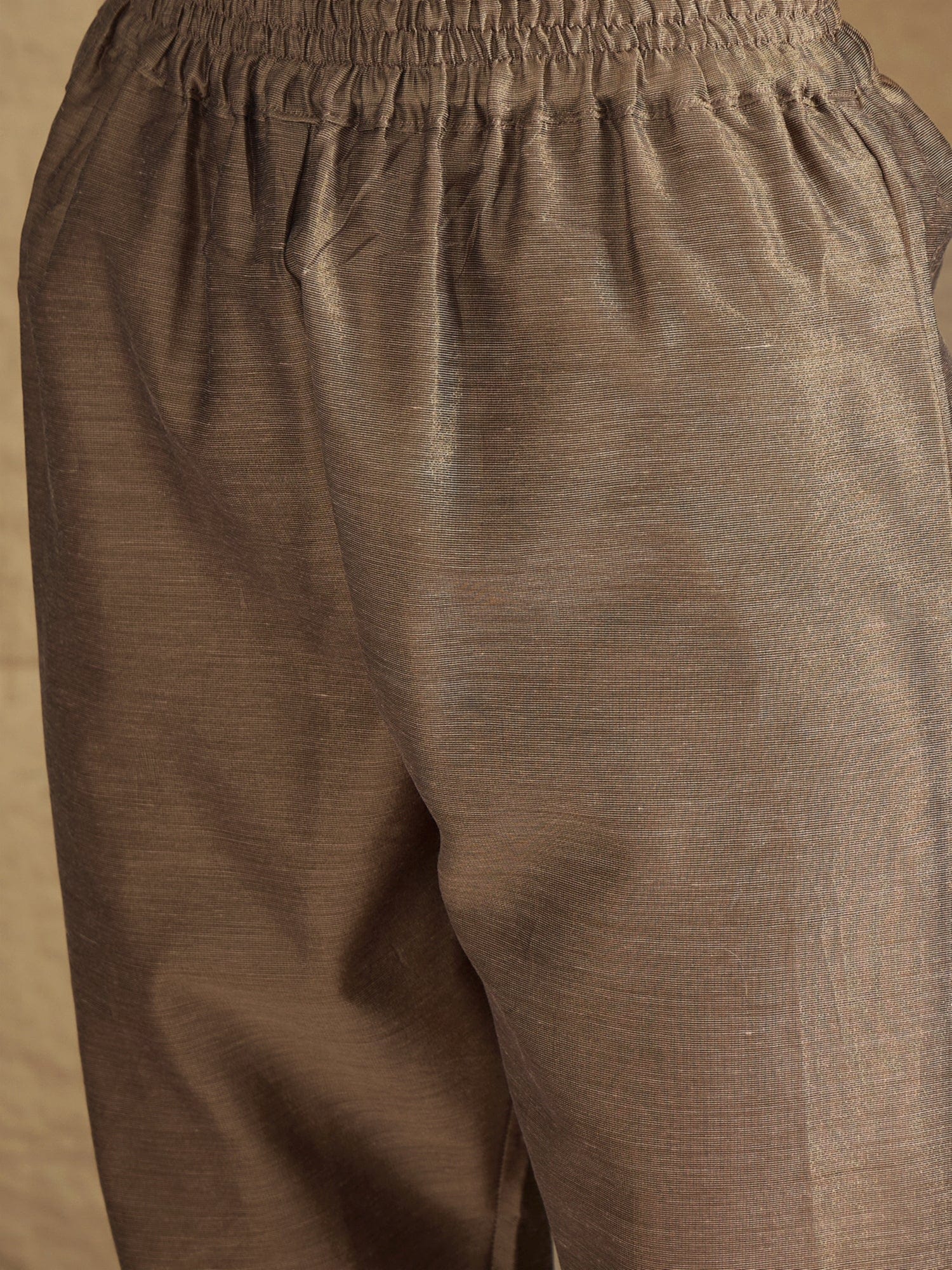 Varanga Women Elegant Three-Piece Brown Shimmer Kurta Set With Sequin Detailing, Solid Ankle-Length Trousers, And An Embroidered Dupatta Perfect For Festive Occasions.