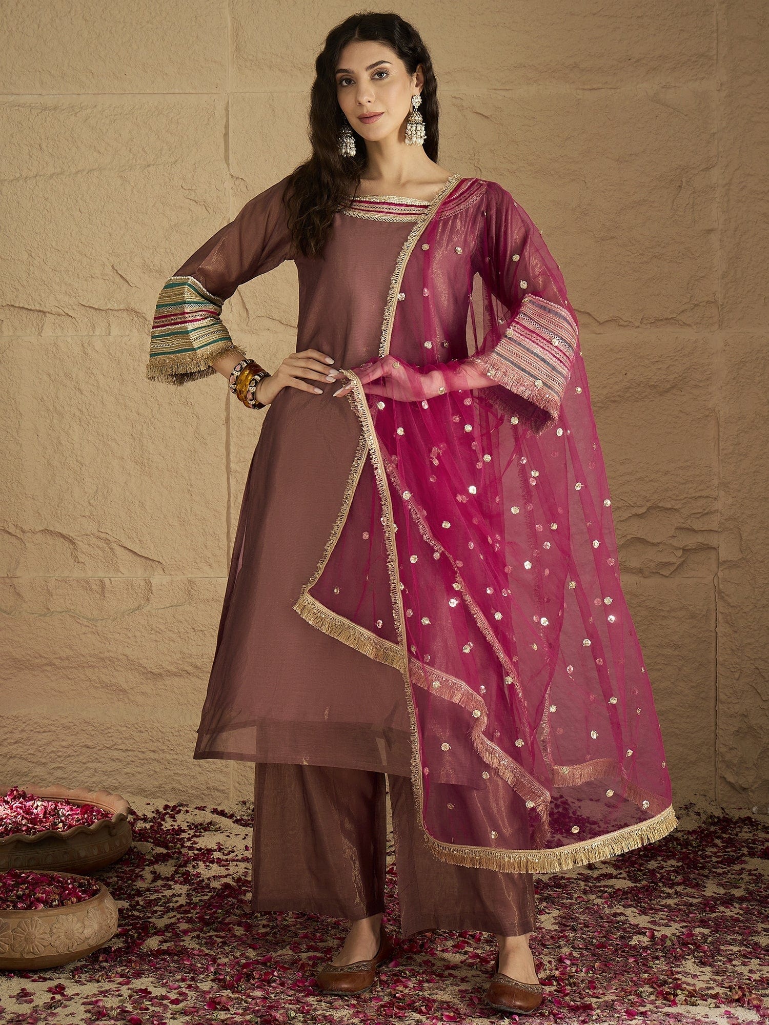 The Kurti Collection Women Graceful Rose Gold A-Line Kurta Set With Shimmer And Lace Detailing, Paired With Solid Trousers And A Net Sequin Dupatta Perfect For Festive Elegance.