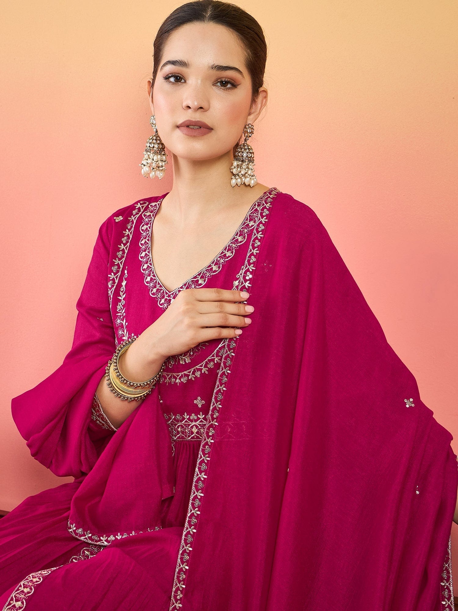 The Kurti Collection Fuchsia Anarkali Set Featuring Front-Slit Kurta With Zari-Embroidered Yoke And Border, Paired With A Floor-Length Sharara And A Bordered Dupatta.