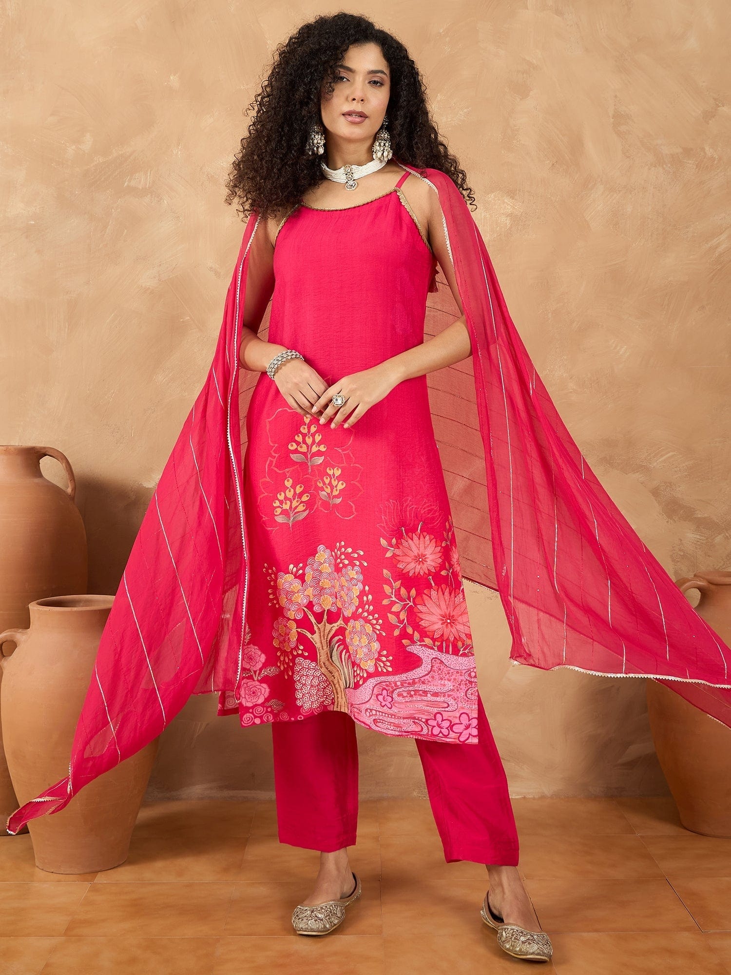 The Kurti Collection Women Spaghetti Tie Up Strap Floral Kurta Featuring Tassles With Trousers And Dupatta