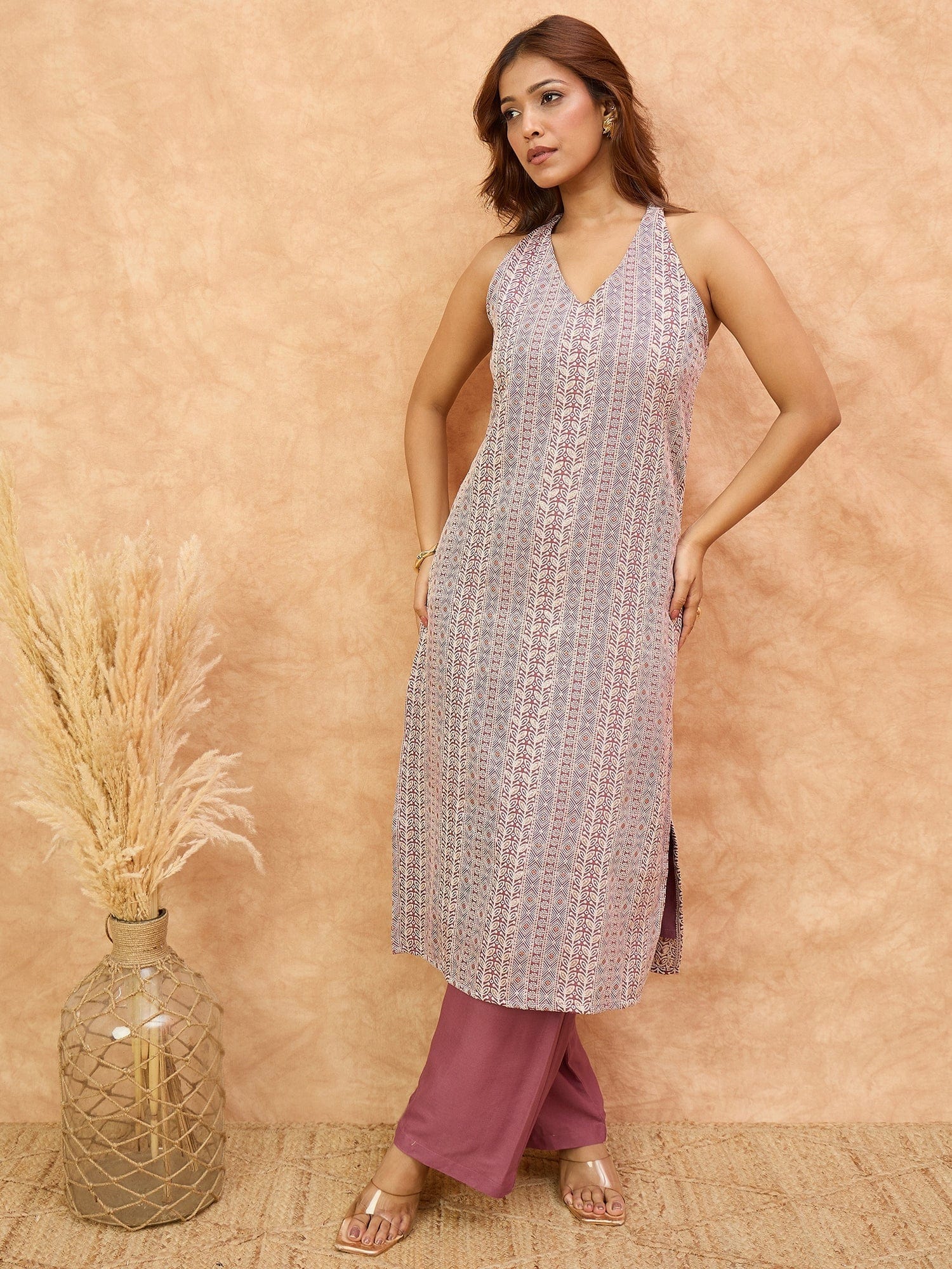 The Kurti Collection Women Mauve Woven Design Sleeveless Kurta, Paired With Solid Bottom.