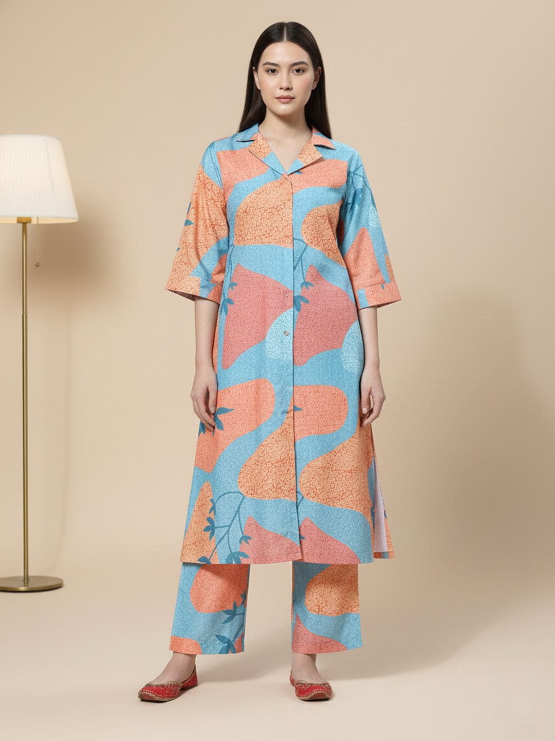 KSUT Women Blue And Rust Abstract Printed Shirt Collar A-Line Kurta Paired With Tonal Bottom