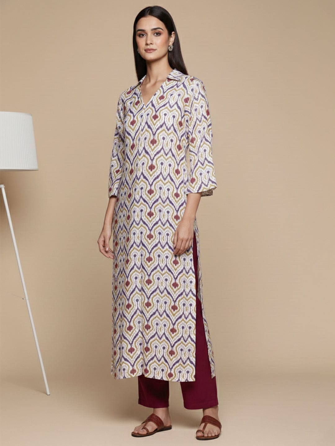 KSUT Women Off White Ikat Printed Shirt Collar Straight Kurta Paired With Violet Solid Bottom.
