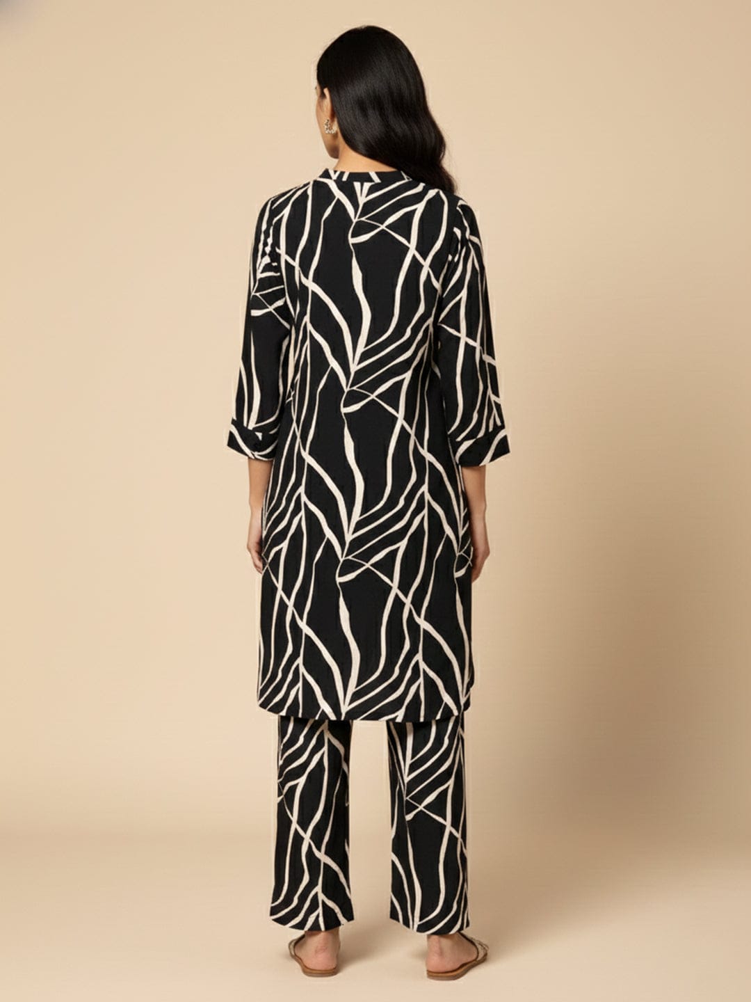 KSUT Women Black & White Abstract Printed Straight Kurta Paired With Tonal Printed Bottom