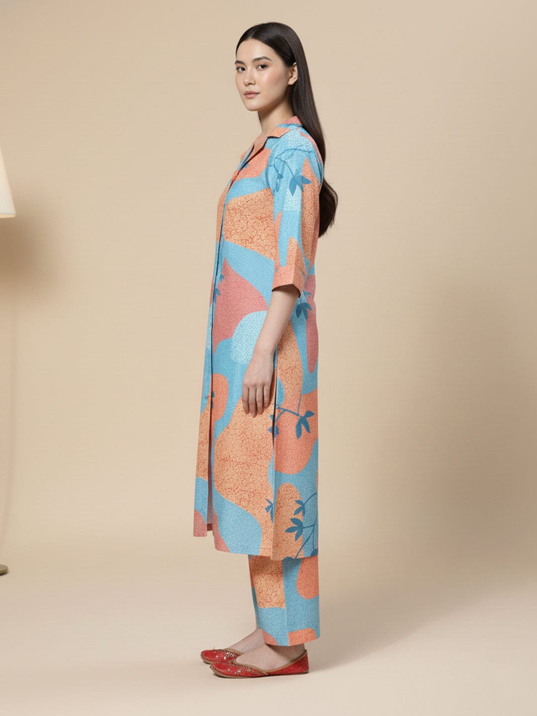 KSUT Women Blue And Rust Abstract Printed Shirt Collar A-Line Kurta Paired With Tonal Bottom